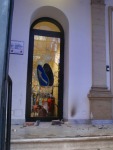 Smashed glass door of a bank